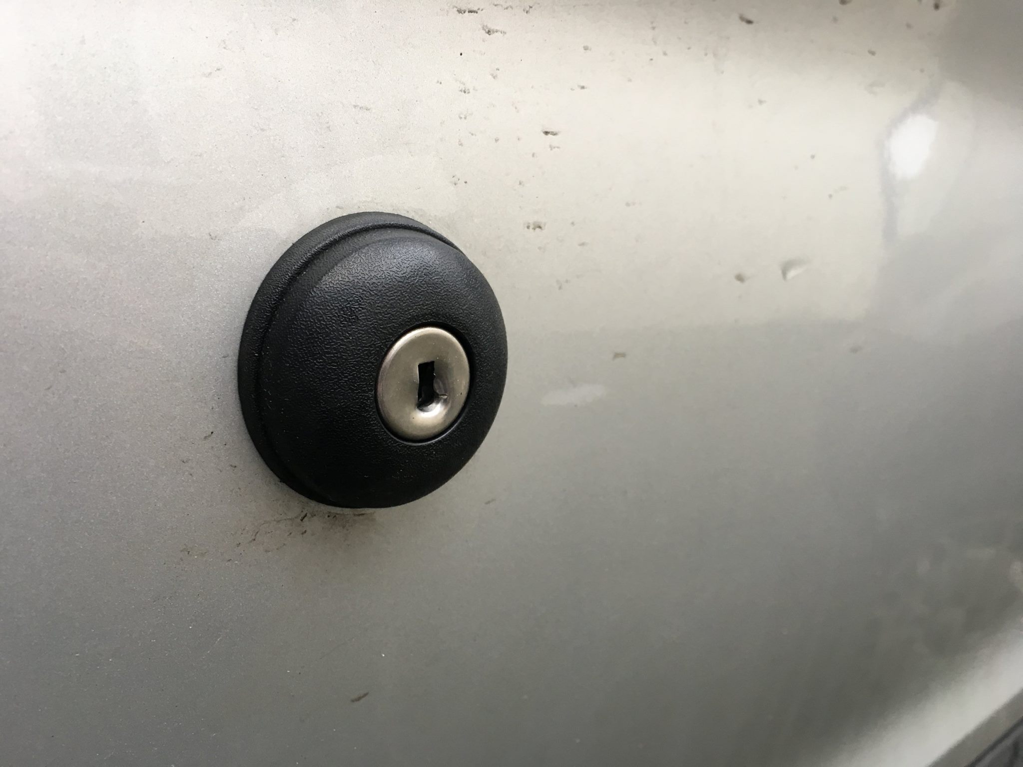 A damaged Ford Transit door lock before installation of a replock.